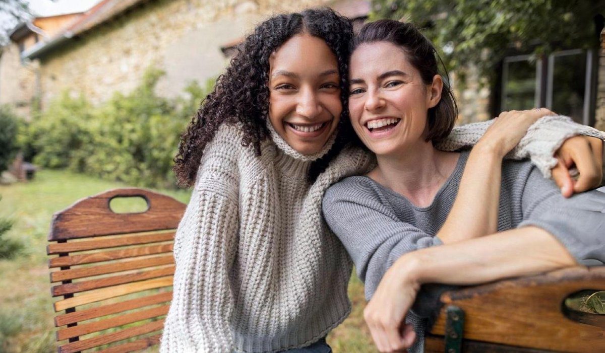 hero-lancaster-mobile Smiling friends sitting together outdoors